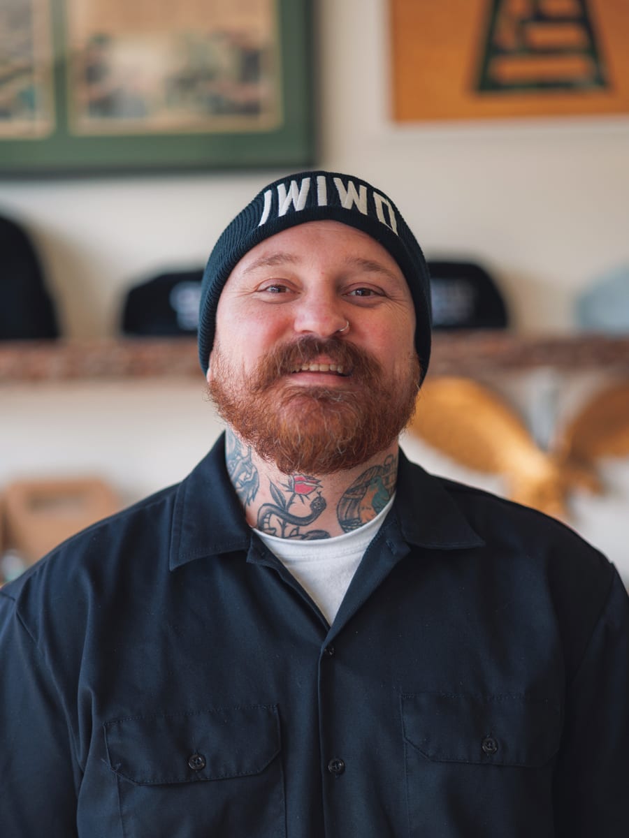 One of the barbers behind the chair at The Green Room